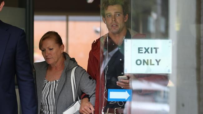 Dale Palmer (pictured, left) is embraced by a supporter after a previous court appearance. Picture: NCA NewsWire / Christian Gilles