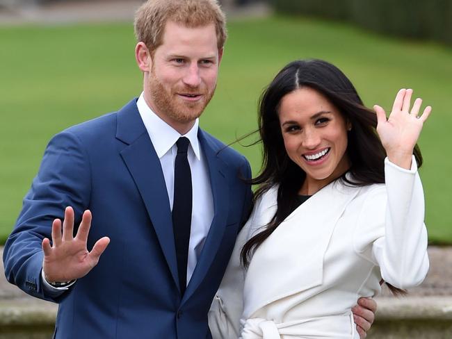 Prince Harry and Meghan Markle pose for the media after announcing their engagement. Picture: Eddie Mulholland/Pool via AP