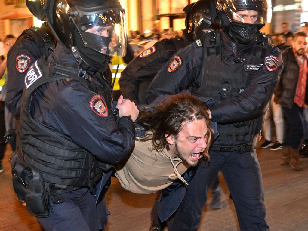 Police officers detain a man in Moscow on September 21 following calls to protest against partial mobilisation announced by President Vladimir Putin. Picture: Alexander Nemenov / AFP