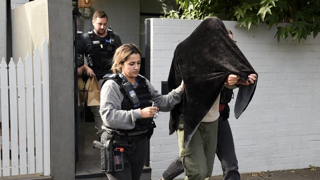 Police arrest an accused drug dealer at his South Melbourne home. Picture: Andrew Henshaw