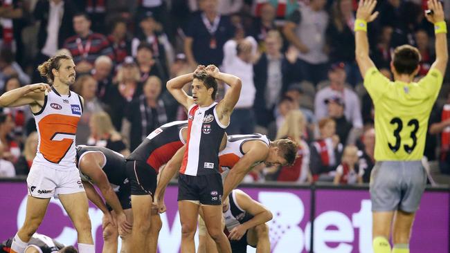 The reaction from players from both teams on the final siren. Picture: Michael Klein