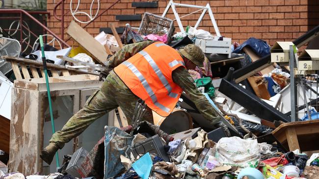 Defence Force personnel assist with the clean up in Lismore in the aftermath of the devastating floods. Photograph: Jason O'Brien