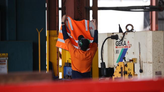 A sign that says ‘If you mess up, fess up’ is covered by staff of the workshop. Picture: Jason Edwards