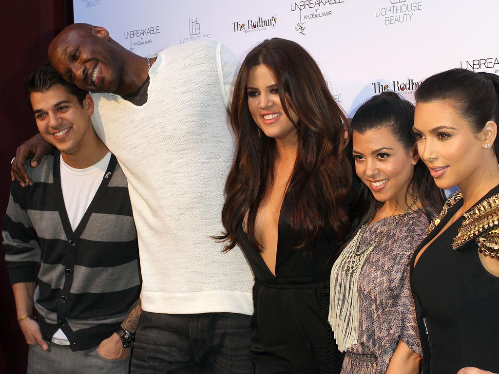 Rob Kardashian, Lamar Odom, Khloe Kardashian Odom, Kourtney Kardashian and Kim Kardashian pose for photographers during their “Unbreakable” Fragrance Launch on April 4, 2011 in Los Angeles, California. Picture: Getty