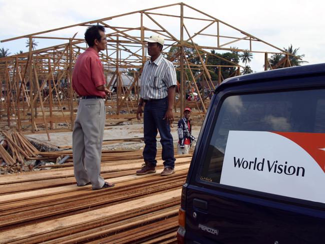 World Vision staff member monitor the construction of transitional centers as the region rebuilds from the tsunami. Picture: World Vision