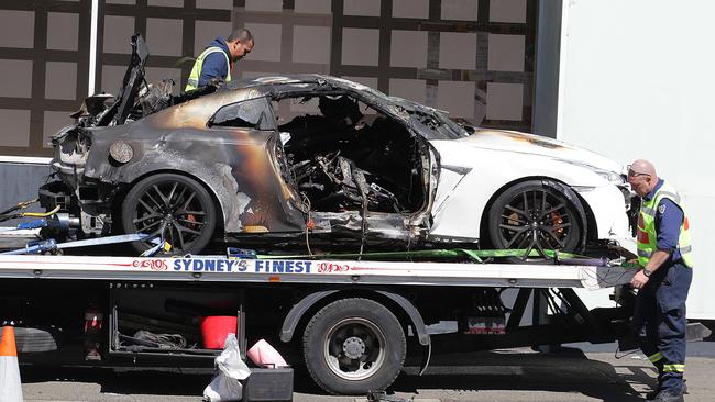 The wreck of the Nissan GTR in which three people were burned to death in central Sydney is towed away for police examination.                         <a capiid="ad8bdfbf8976c7863d313807374de574" class="capi-video">Three killed in fiery Sydney car crash</a>