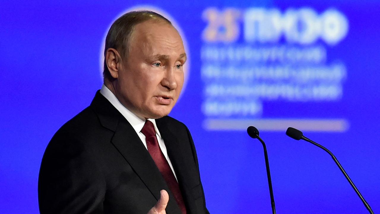 Russian President Vladimir Putin gives a speech at a plenary session of the Saint Petersburg International Economic Forum. (Photo by Olga MALTSEVA / AFP)