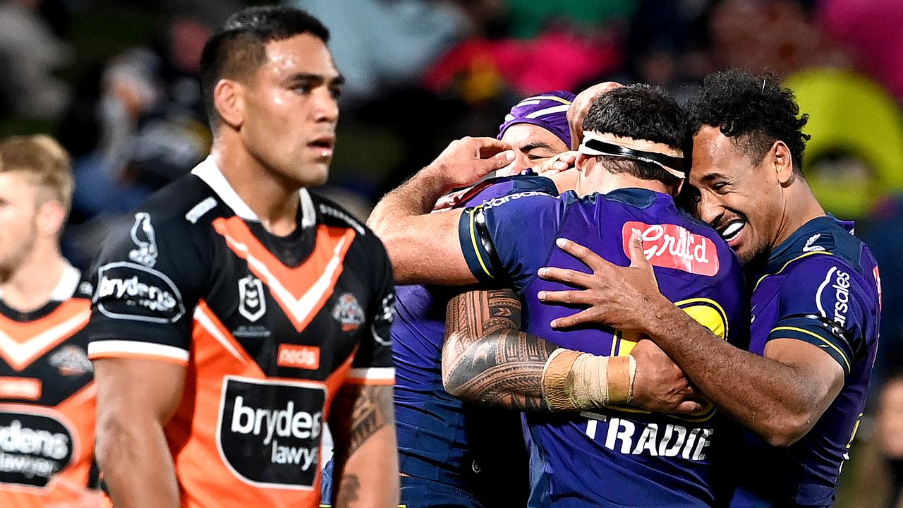 Nelson Asofa-Solomona of the Storm is congratulated by teammates after scoring a try.