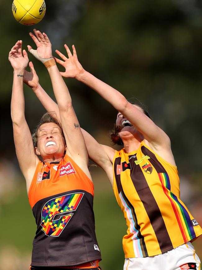 A Giants player and her Hawks opponent fly for a marking duel. Pictures: Getty Images