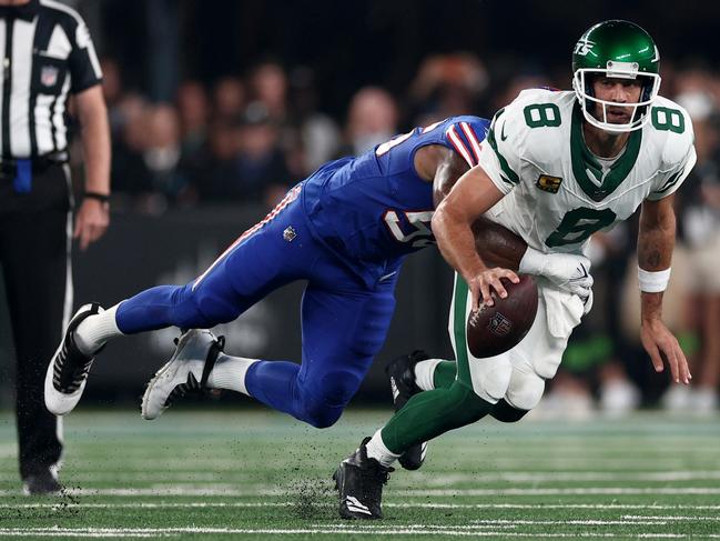 EAST RUTHERFORD, NEW JERSEY - SEPTEMBER 11: Quarterback Aaron Rodgers #8 of the New York Jets sacked by defensive end Leonard Floyd #56 of the Buffalo Bills during the first quarter of the NFL game at MetLife Stadium on September 11, 2023 in East Rutherford, New Jersey. (Photo by Elsa/Getty Images)