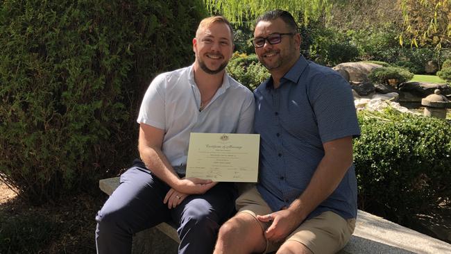 Correctional services officer Stewart Iain Berry, left, and his husband Mathew Campbell, right, on their wedding day. Picture: Supplied.