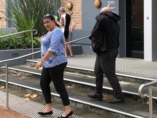 Evans covered his face while leaving court with his wife. Picture: supplied