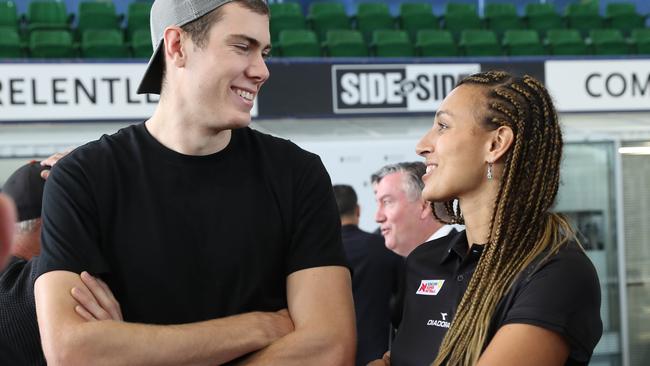 Collingwood star Mason Cox and his girlfriend, netball player Geva Mentor. Picture: AAP Image/David Crosling