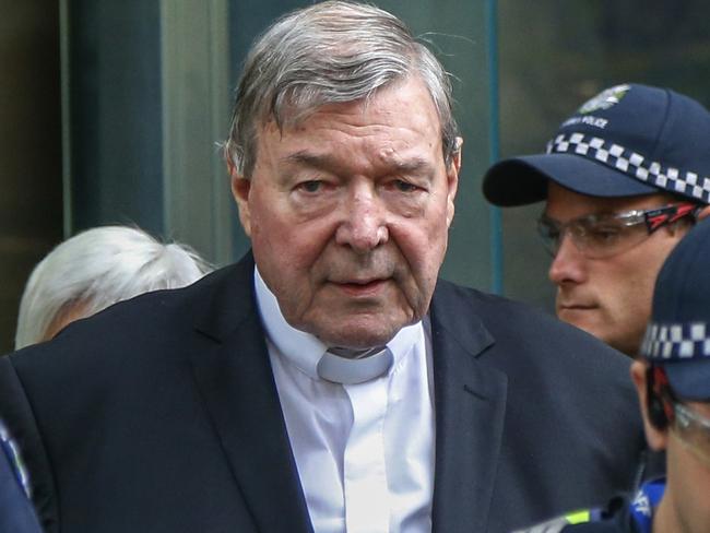 FILE - In this May 2, 2018, file photo, Cardinal George Pell, the most senior Catholic cleric to face sex charges, leaves court in Melbourne, Australia. Pell was sentenced in an Australian court on Wednesday, March 13, 2019 to 6 years in prison for molesting two choirboys in a Melbourne cathedral more than 20 years ago.  (AP Photo/Asanka Brendon Ratnayake, File)