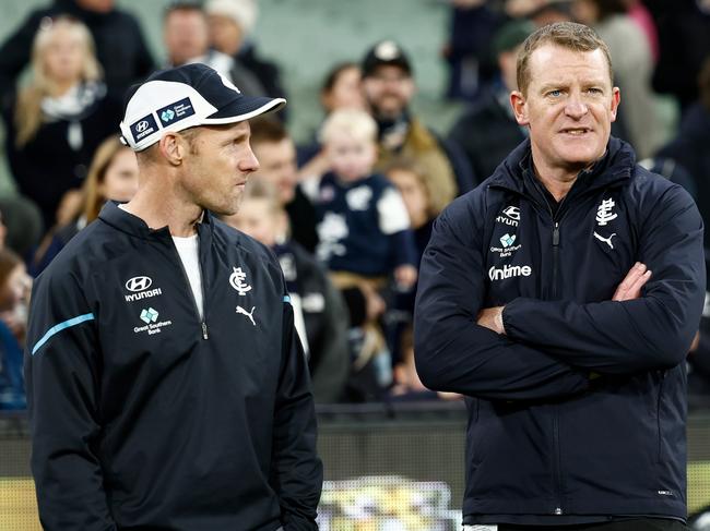 MELBOURNE, AUSTRALIA - JUNE 30: Andrew Russell and Michael Voss, Senior Coach of the Blues are seen during the 2024 AFL Round 16 match between the Richmond Tigers and the Carlton Blues at The Melbourne Cricket Ground on June 30, 2024 in Melbourne, Australia. (Photo by Michael Willson/AFL Photos via Getty Images)