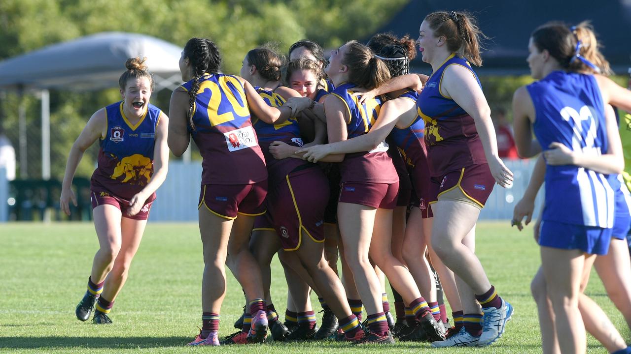 The Glenmore Bullettes celebrate their grand final win over Brothers at Swan Park on Saturday. Photo: Jann Houley