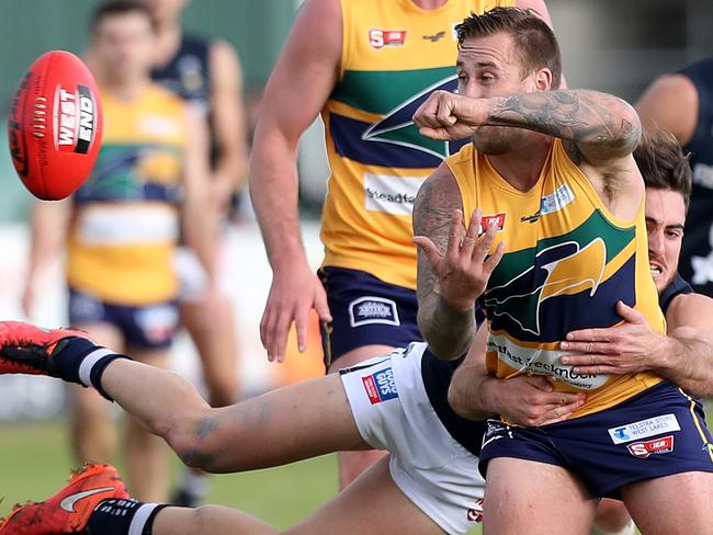 25/06/16 Woodville West Torrens v South Adelaide at Woodville Oval. Scott Lewis tackled by Nic Schwarz. photo Calum Robertson