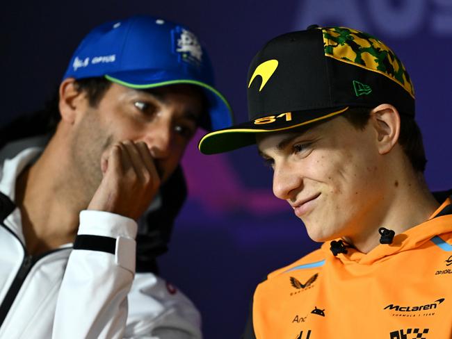 MELBOURNE, AUSTRALIA - MARCH 21: Daniel Ricciardo of Australia and Visa Cash App RB and Oscar Piastri of Australia and McLaren talk in the Drivers Press Conference during previews ahead of the F1 Grand Prix of Australia at Albert Park Circuit on March 21, 2024 in Melbourne, Australia. (Photo by Quinn Rooney/Getty Images)