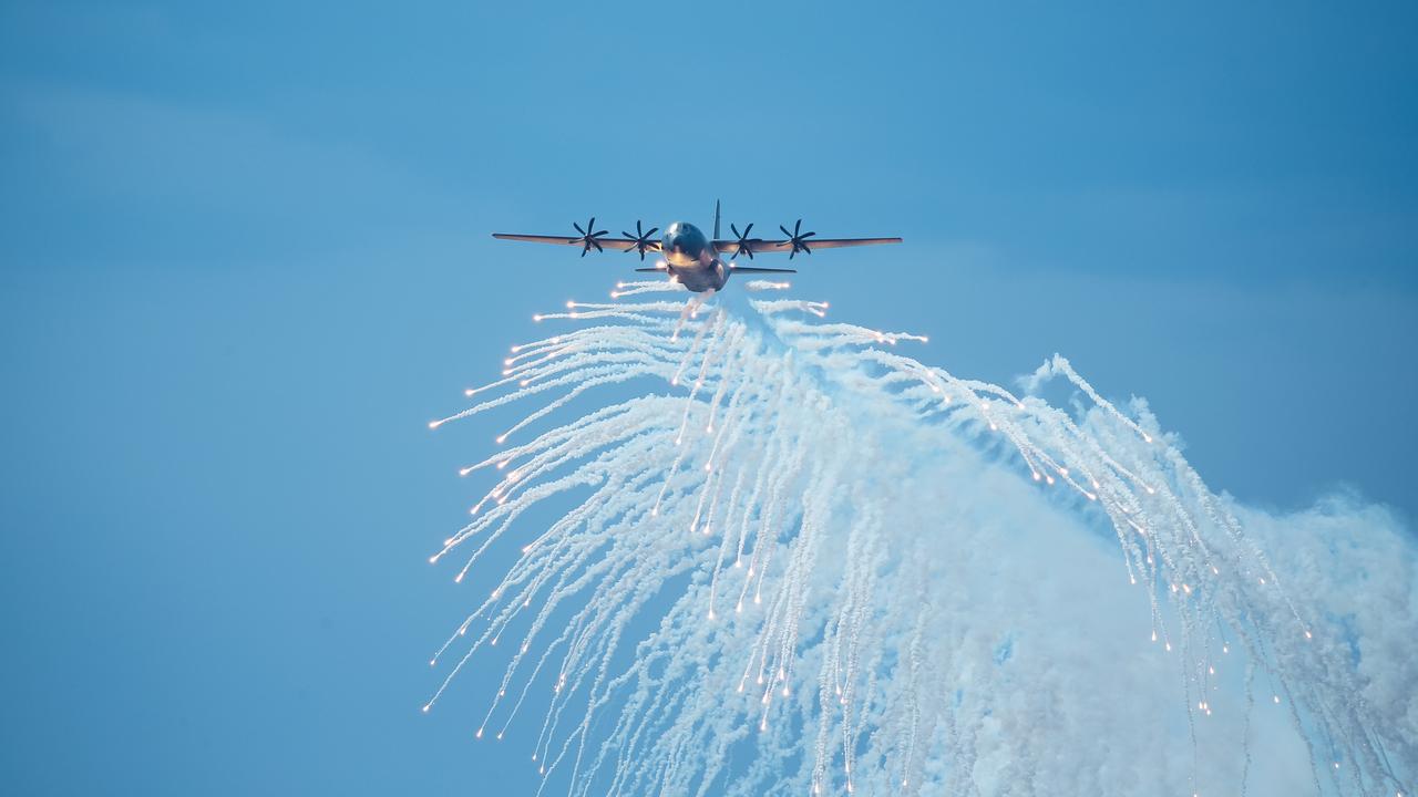 A RAAF Hercules does a flare drop opening the inaugural Pacific Air Show over Surfers Paradise. Picture: Glenn Campbell