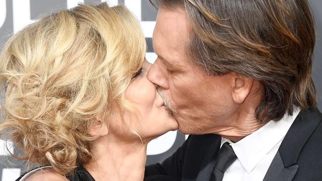 BEVERLY HILLS, CA - JANUARY 07: Actors Kyra Sedgwick (L) and Kevin Bacon attend The 75th Annual Golden Globe Awards at The Beverly Hilton Hotel on January 7, 2018 in Beverly Hills, California.   Frazer Harrison/Getty Images/AFP == FOR NEWSPAPERS, INTERNET, TELCOS & TELEVISION USE ONLY ==