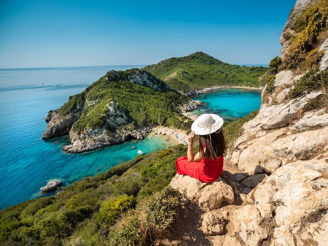 Young woman enjoy the holiday view of Porto Timoni, Corfu in Greece.