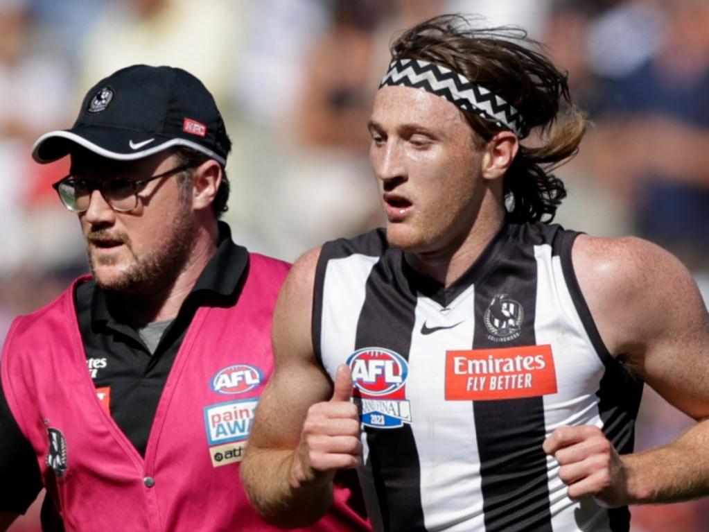 MELBOURNE, AUSTRALIA - SEPTEMBER 30: Nathan Murphy of the Magpies leaves the ground in the hands of a trainer during the 2023 AFL Grand Final match between the Collingwood Magpies and the Brisbane Lions at the Melbourne Cricket Ground on September 30, 2023 in Melbourne, Australia. (Photo by Russell Freeman/AFL Photos via Getty Images)