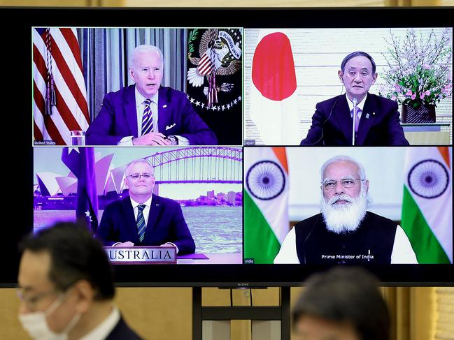 A monitor displaying the virtual meeting of US President Joe Biden (top L) with Scott Morrison (bottom L), Japan's Prime Minister Yoshihide Suga (top R) and India's Prime Minister Narendra Modi. Picture: AFP