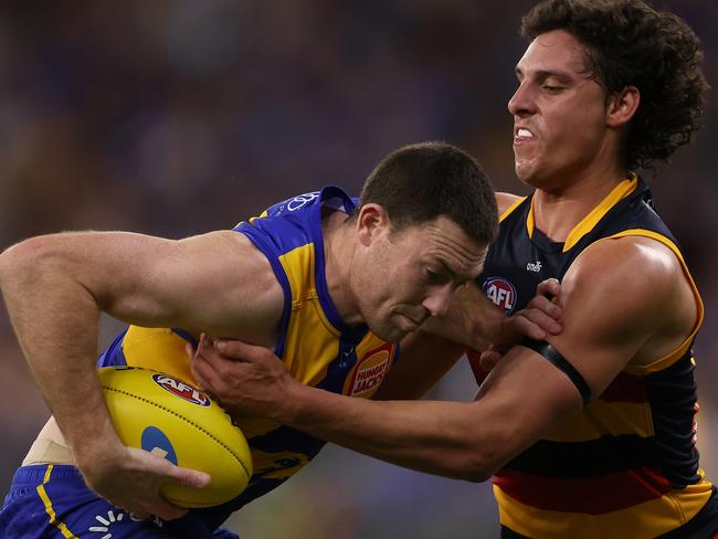 PERTH, AUSTRALIA - AUGUST 26: James Borlase of the Crows tackles Jeremy McGovern of the Eagles during the round 24 AFL match between the West Coast Eagles and Adelaide Crows at Optus Stadium, on August 26, 2023, in Perth, Australia. (Photo by Paul Kane/Getty Images)