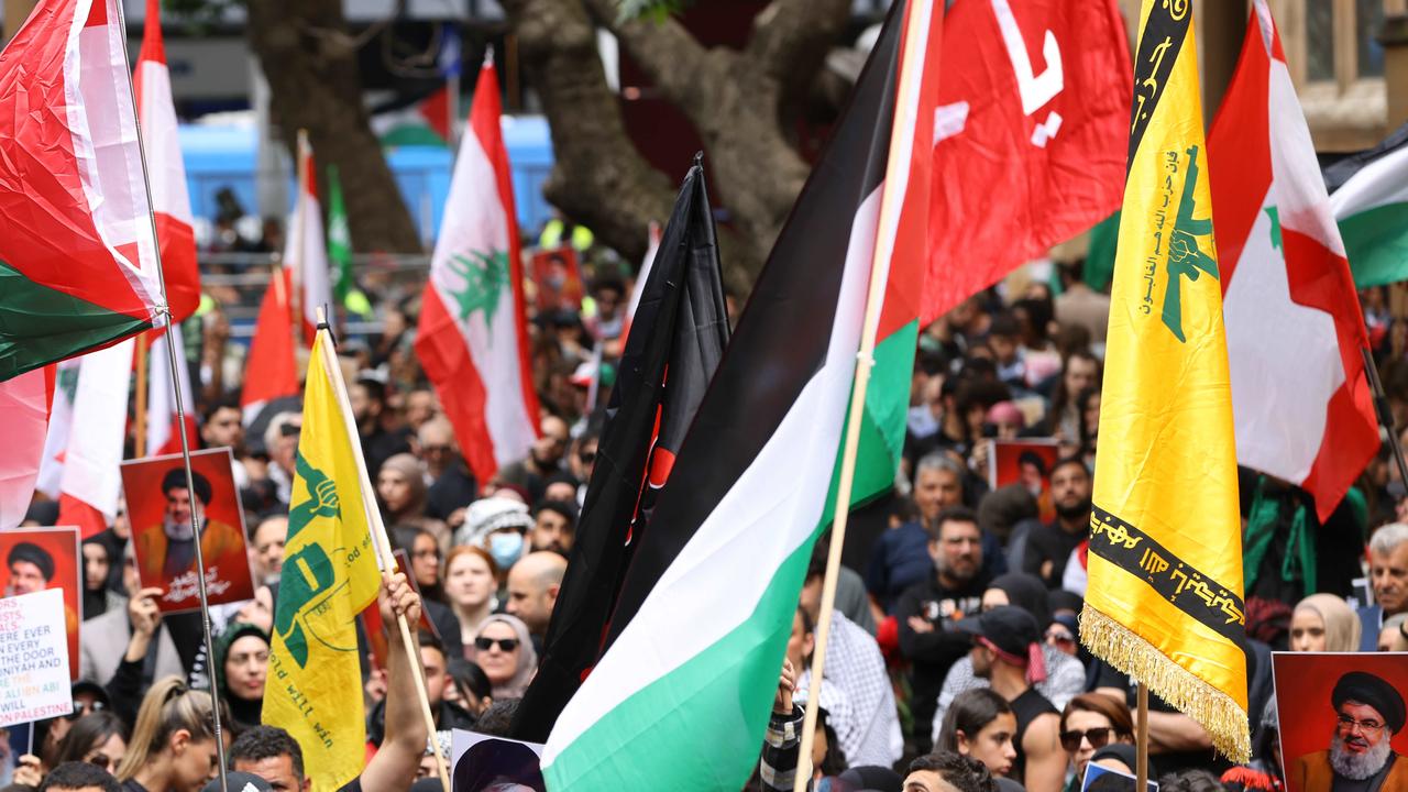 People waved Hezbollah flags at a protest at Sydney’s Town Hall on Sunday. Picture: NewsWire / Damian Shaw