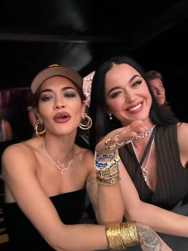 Rita Ora and Katy Perry watch the show.