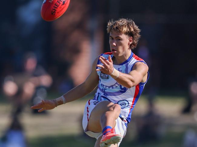 Aaron Sharkie gets a kick away for the Oakleigh Chargers. Picture: Rob Lawson/AFL Photos