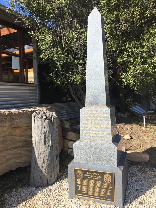 The stump and memorial beside the Bushranger Hotel in Collector NSW, formerly known at Kimberley's Inn. Picture: Charles Miranda