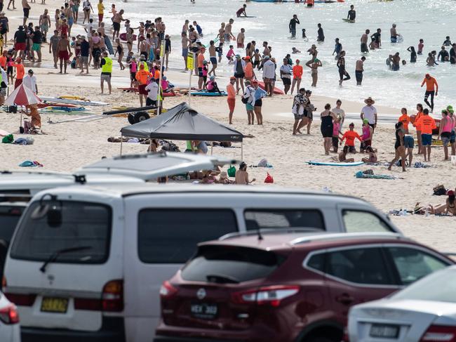 SYDNEY, AUSTRALIA - NewsWire Photos November 29, 2020: A view of people enjoying the hot weather on Bondi Beach, and cars in the Queen Elizabeth Drive Car Park, Sydney. Picture: NCA NewsWire / James Gourley