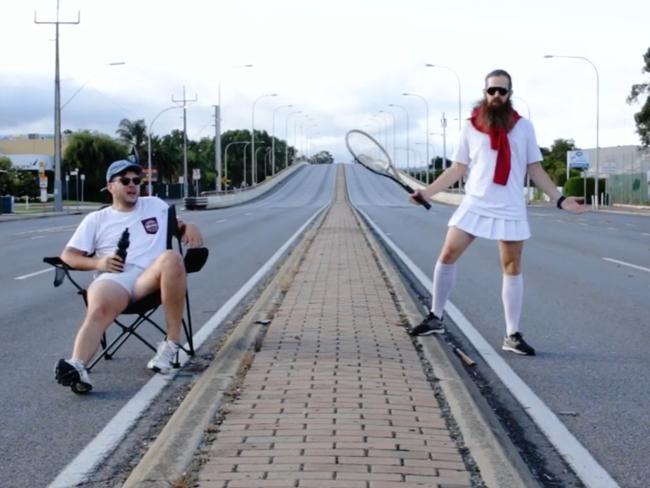 Ryley Smithson and Cameron Doyle decided to take advantage of the sudden shutdown of Adelaide's busiest thoroughfare by having a spot of tennis on it. Source: Facebook