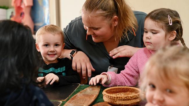 First Grammar Freshwater childcare trainee Kiyah Drury guides George Gibbon, 3, Harper Dalzel, 4, Frankie Booth, 3, and Sritha Patel, 4, through play-based learning. Picture: Isaac McCarthy