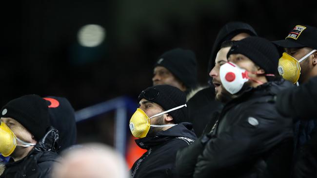 Fans wear face masks during the FA Cup Fifth Round match between Leicester City and Birmingham City at The King Power Stadium this week in Leicester, England. Picture: Alex Pantling, Getty Images.