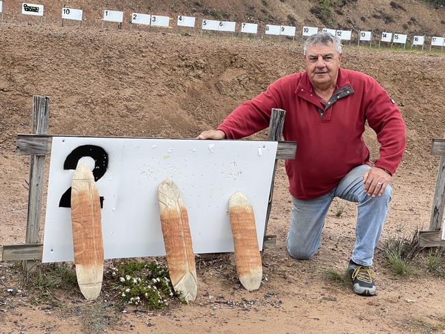 Butchulla elder Glen Miller with the shields that will form the moulds for the Maryborough monument to lives lost at settlement.