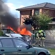 Firefighters attend the blazing getaway vehicle. Picture: Supplied