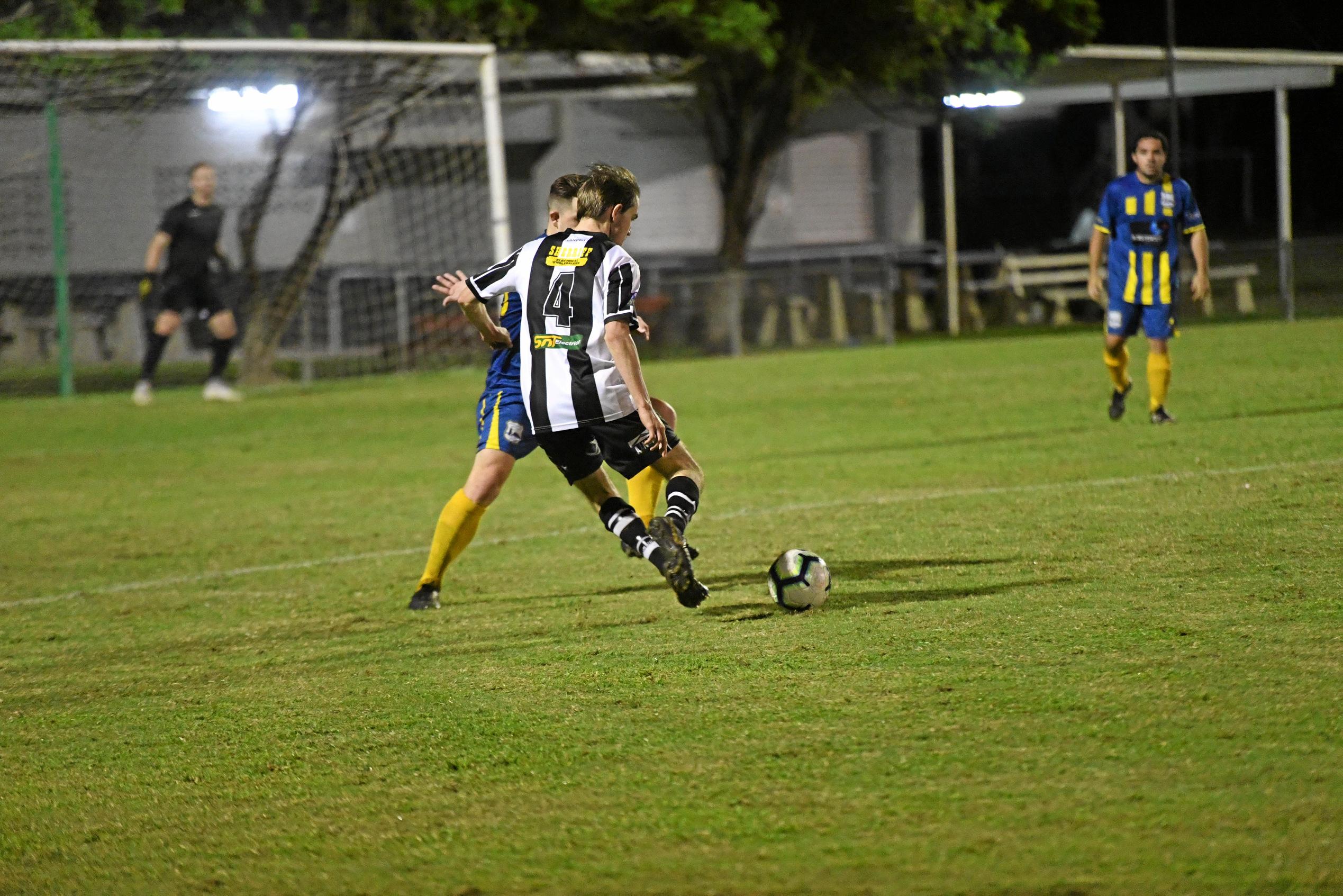 Bingera's Cody Breuer crosses the ball. Picture: Shane Jones