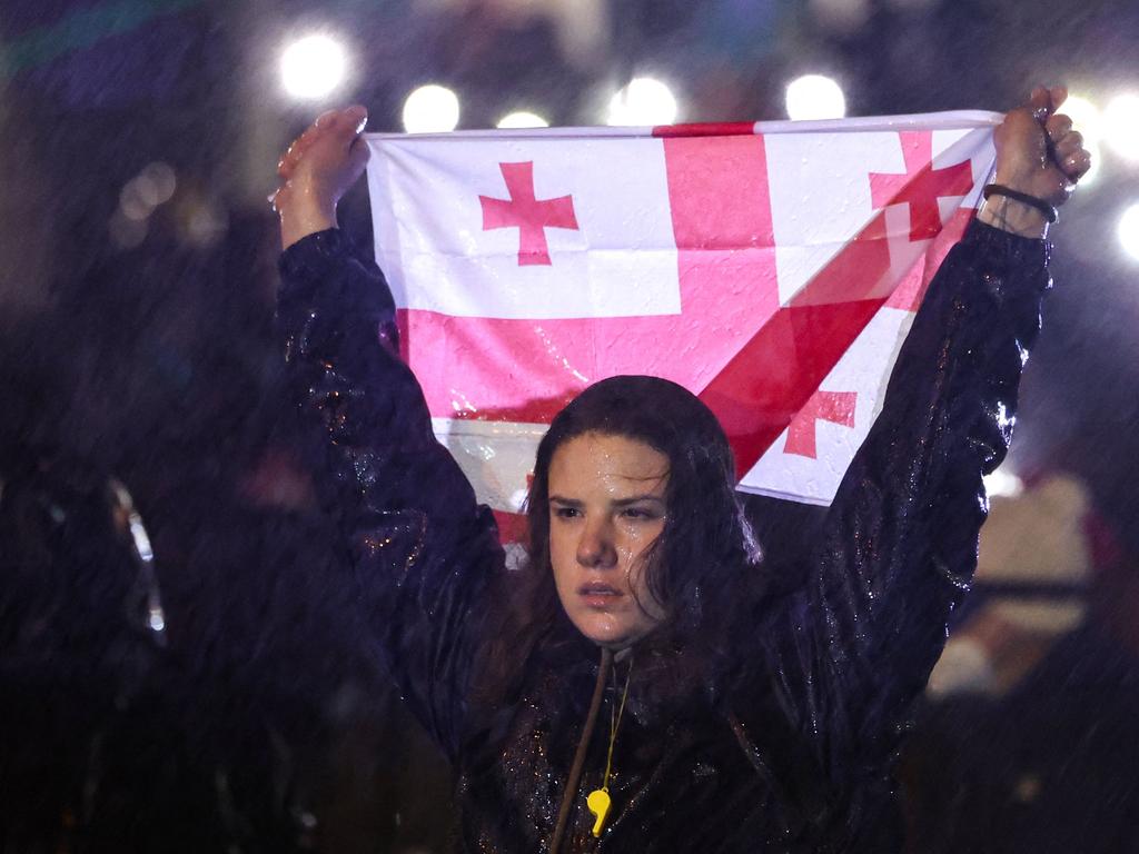 Protesters face police during the fifth straight night of demonstrations against the government’s postponement of EU accession talks until 2028, in central Tbilisi on December 2, 2024. Picture: Giorgi ARJEVANIDZE / AFP