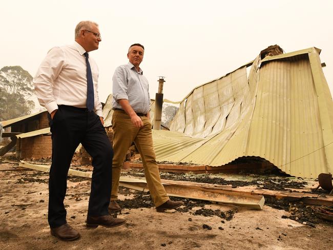 Prime Minister Scott Morrison and Darren Chester in fire-ravaged Sarsfield. Picture: James Ross