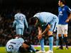 Manchester City's Argentinian striker Sergio Aguero (L) lies injured during the English Premier League football match between Manchester City and Everton at the Etihad Stadium in Manchester, north west England, on December 6, 2014. AFP PHOTO / LINDSEY PARNABY RESTRICTED TO EDITORIAL USE. No use with unauthorized audio, video, data, fixture lists, club/league logos or “live” services. Online in-match use limited to 45 images, no video emulation. No use in betting, games or single club/league/player publications.