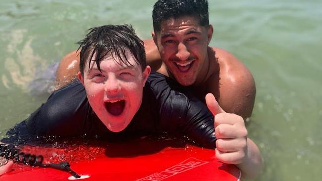 Eels star Dylan Brown at the beach with a What Ability participant, Luke. Picture: Supplied