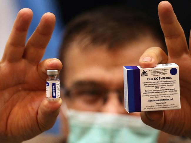 An Iranian health worker displays the Sputnik V coronavirus vaccine. Picture: AFP