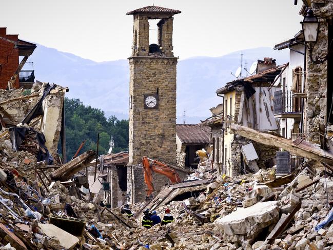 Getty Images Year in Focus 2016: Firefighters continue removing rubble near the bell tower in Amatrice, central Italy on August 30, 2016 Italy. Italy was struck by a powerful, 6.2-magnitude earthquake in the night of August 24, 2016, which has killed at least 293 people and devastated dozens of houses in the Lazio village of Pescara del Tronto, Accumoli and Amatrice. Photo by Stefano Montesi/Corbis via Getty Images