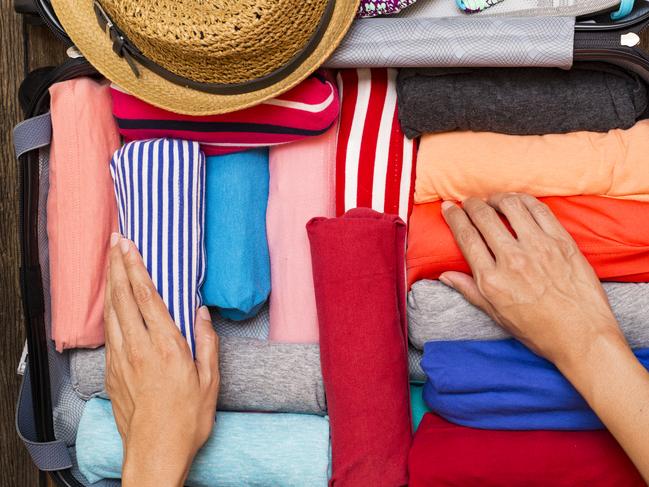 woman packing a luggage for a new journey