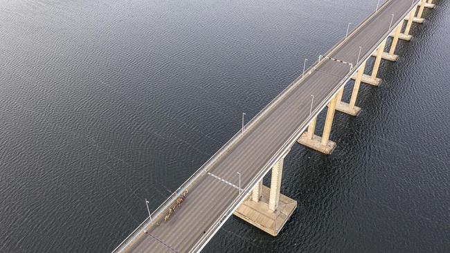 John Elliott crosses the Tasman Bridge with his five camels on Sunday morning. Picture: Nick Jaffe.