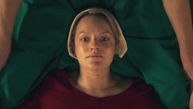 Elisabeth Moss in one of the most confronting scenes from The Handmaid's Tale.