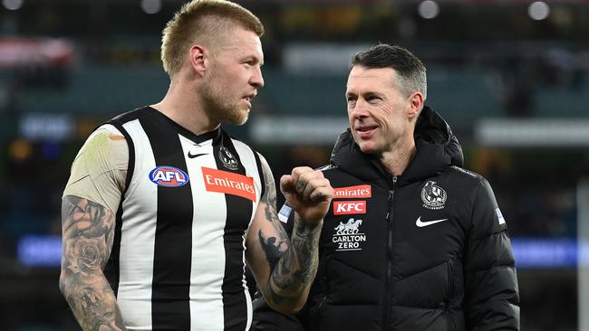 MELBOURNE, AUSTRALIA - SEPTEMBER 10: Jordan De Goey of the Magpies speaks to Magpies head coach Craig McRae after winning the AFL First Semifinal match between the Collingwood Magpies and the Fremantle Dockers at Melbourne Cricket Ground on September 10, 2022 in Melbourne, Australia. (Photo by Quinn Rooney/Getty Images)