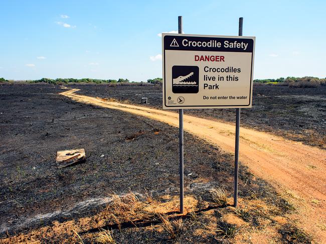 A new crocodile safety sign has been erected at the track leading top the fishing spot along the Adelaide River where Lanh Van Tran was taken.